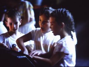 Kids interacting with plasma exhibit